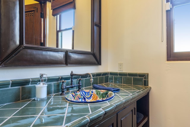 bathroom featuring vanity and a healthy amount of sunlight