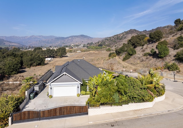 birds eye view of property with a mountain view