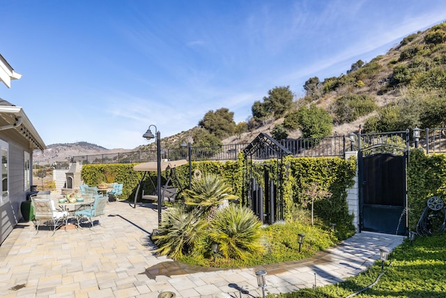 view of patio / terrace with a mountain view