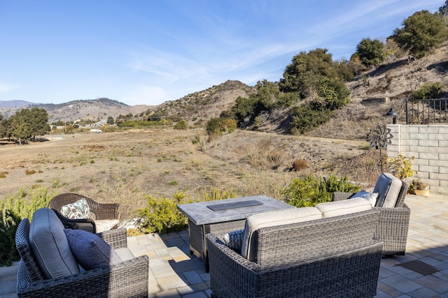 view of patio / terrace featuring a mountain view