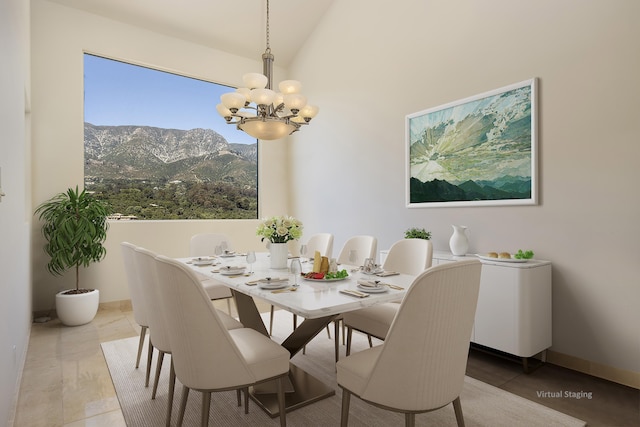 tiled dining area featuring a mountain view, vaulted ceiling, and an inviting chandelier