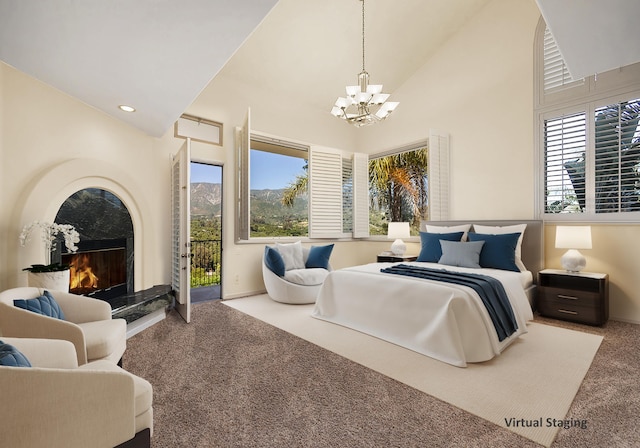 carpeted bedroom featuring access to outside, a fireplace, high vaulted ceiling, and a chandelier