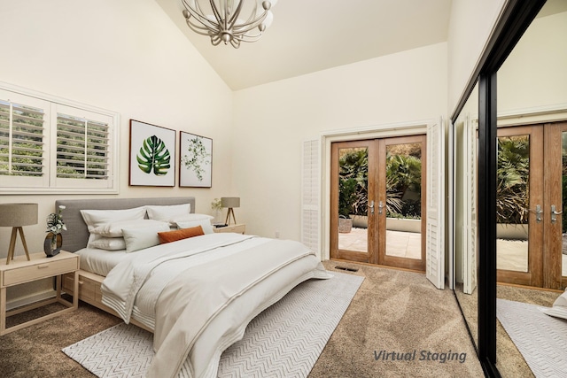 carpeted bedroom with access to exterior, multiple windows, and french doors