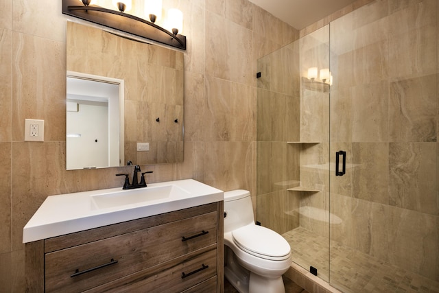 bathroom featuring toilet, a shower with door, and tile walls