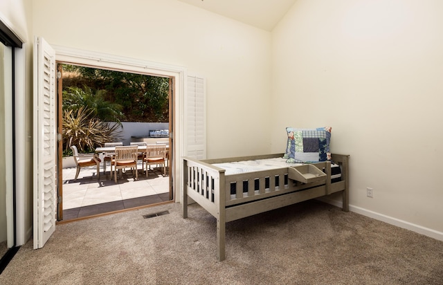 carpeted bedroom featuring vaulted ceiling