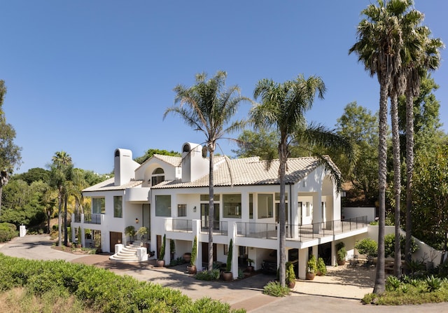 view of front of home with a balcony