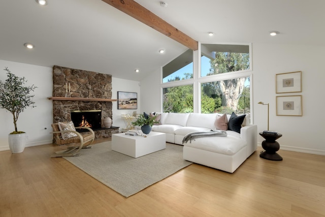 living room with baseboards, wood finished floors, vaulted ceiling with beams, a fireplace, and recessed lighting