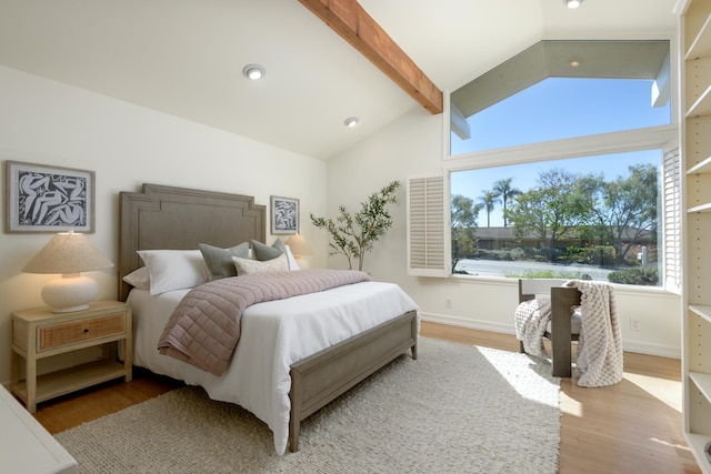 bedroom with vaulted ceiling with beams, baseboards, wood finished floors, and recessed lighting