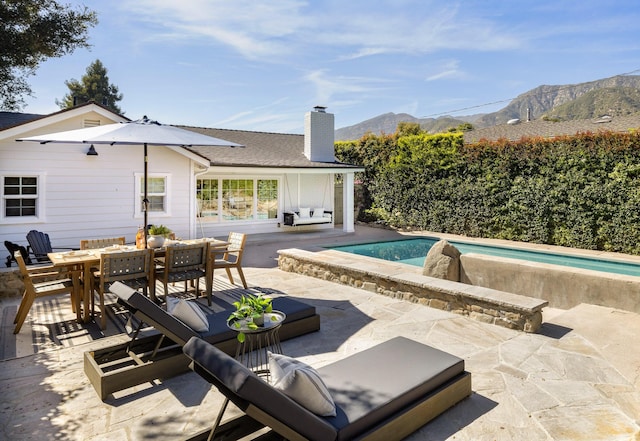 exterior space featuring a patio and a mountain view