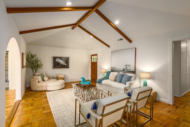 living area with baseboards, arched walkways, and recessed lighting