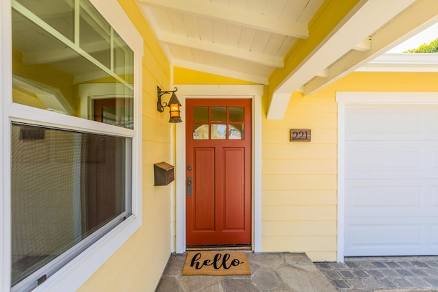 doorway to property featuring a garage