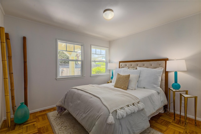 bedroom with baseboards and ornamental molding