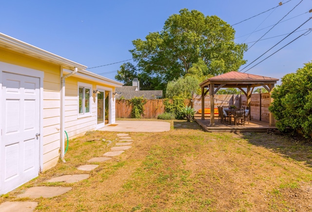view of yard featuring a fenced backyard, a gazebo, and a patio