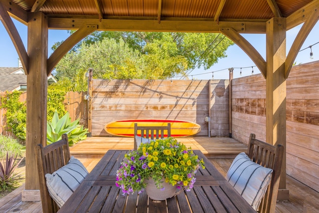 view of patio / terrace with fence and a deck