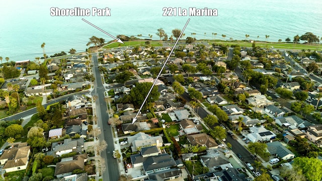 drone / aerial view featuring a water view and a residential view