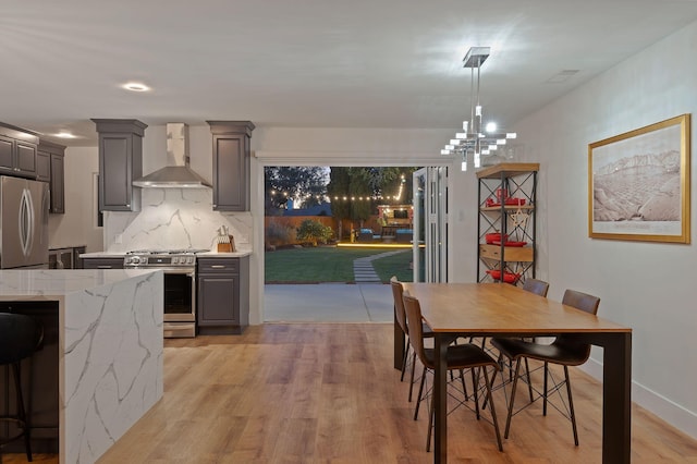 interior space featuring a notable chandelier and light hardwood / wood-style flooring