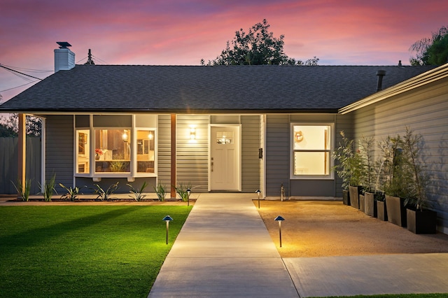 view of front of house with a yard