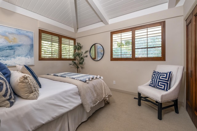 bedroom with vaulted ceiling with beams, wooden ceiling, baseboards, and carpet flooring