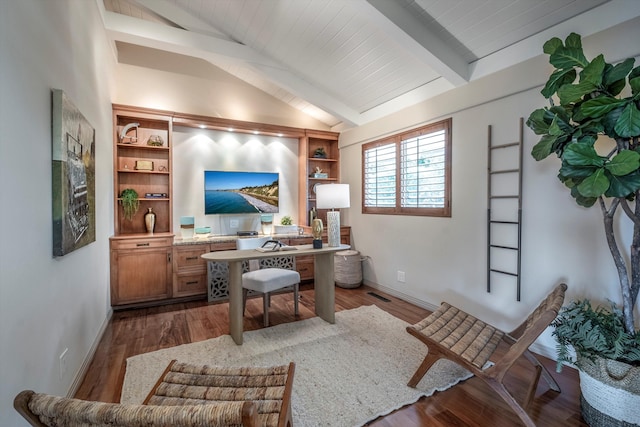 office area featuring lofted ceiling with beams, baseboards, visible vents, and wood finished floors