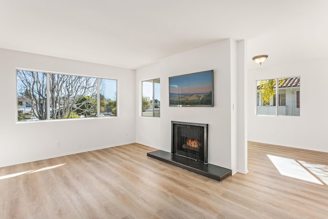 unfurnished living room with light hardwood / wood-style floors