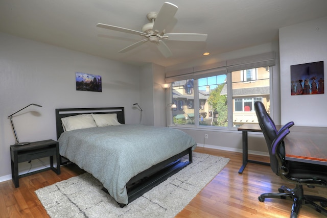 bedroom featuring ceiling fan and hardwood / wood-style floors