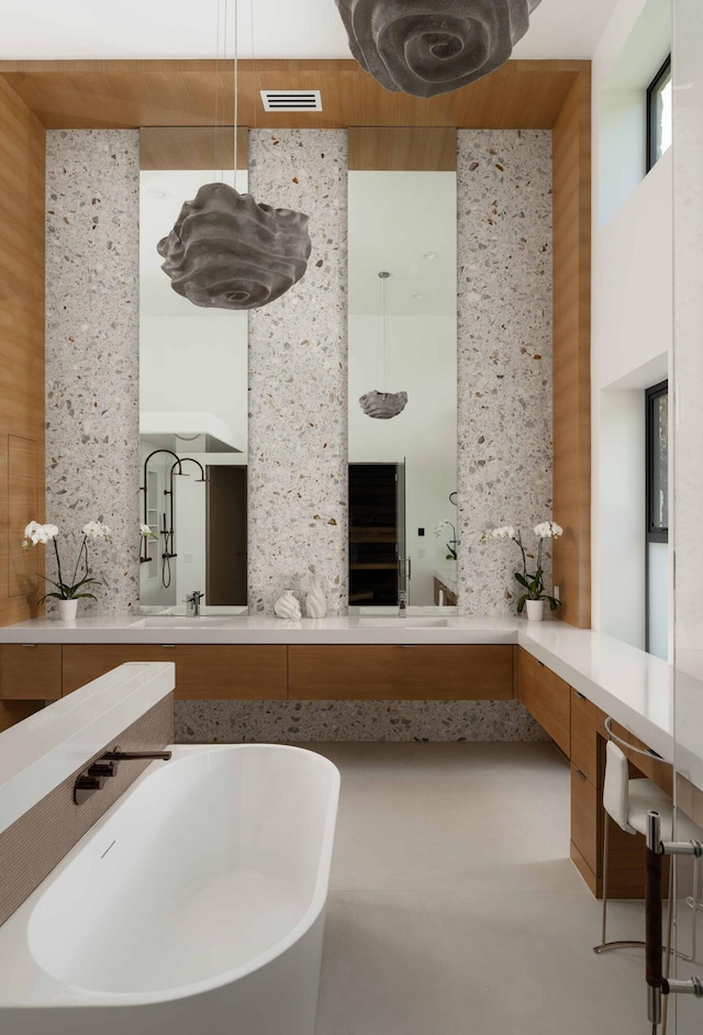 bathroom featuring vanity and a bathing tub