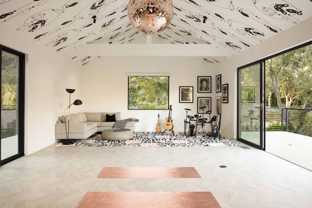 unfurnished living room featuring high vaulted ceiling