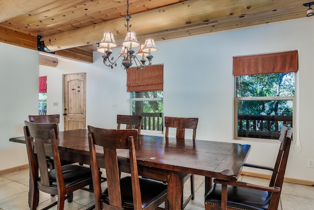 tiled dining area featuring a notable chandelier and wooden ceiling