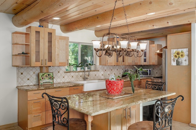 kitchen featuring decorative backsplash, a kitchen bar, light stone countertops, sink, and beamed ceiling