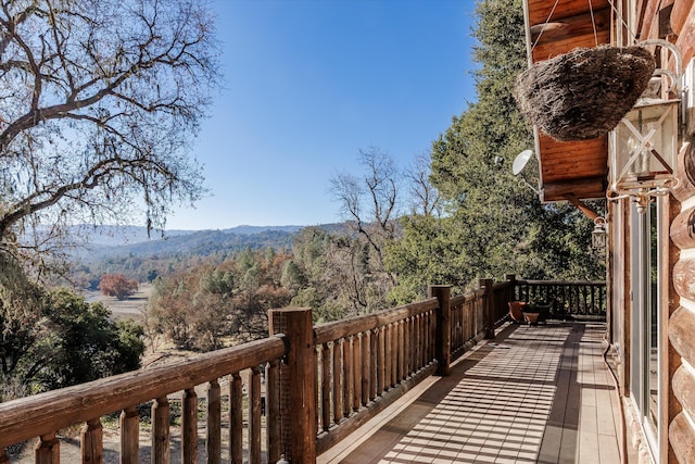 wooden deck featuring a mountain view