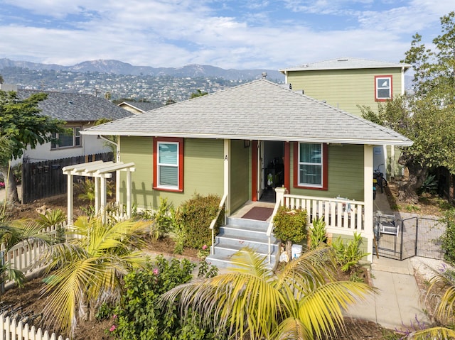 bungalow featuring a mountain view and covered porch