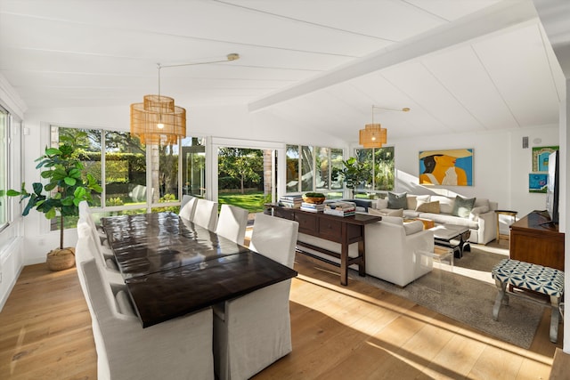 sunroom with lofted ceiling with beams