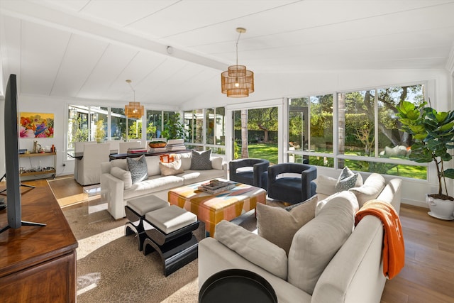 sunroom with vaulted ceiling with beams