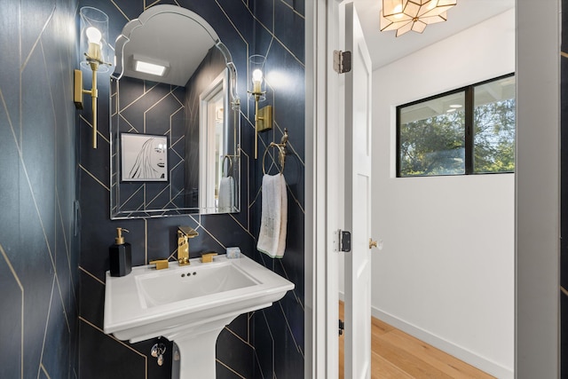 bathroom with hardwood / wood-style flooring