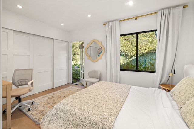 bedroom featuring a closet and light hardwood / wood-style floors