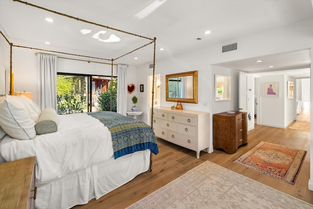 bedroom featuring light hardwood / wood-style flooring and access to exterior