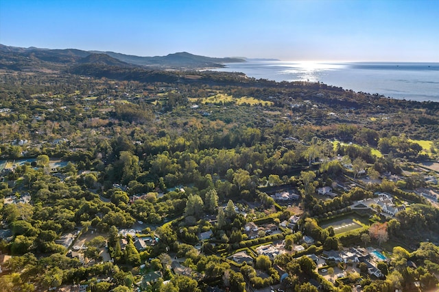 drone / aerial view featuring a water and mountain view