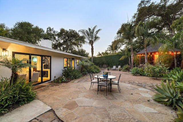 view of patio terrace at dusk