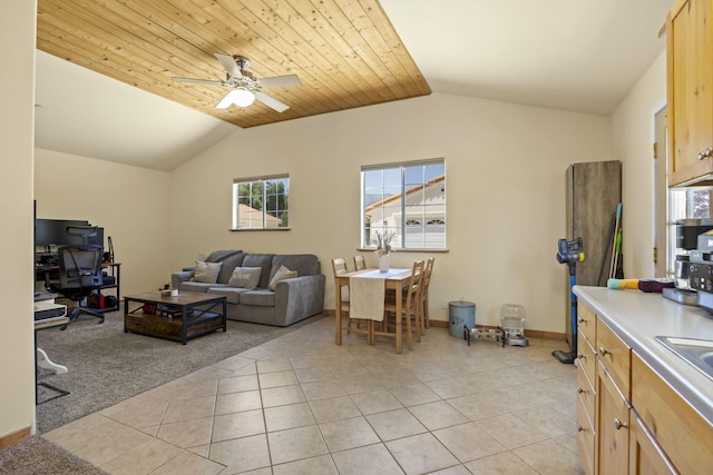 living room with ceiling fan, light tile patterned floors, wood ceiling, and lofted ceiling