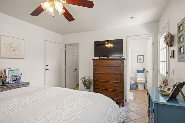 bedroom with ensuite bath and ceiling fan