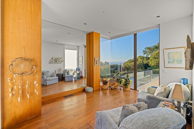 interior space featuring floor to ceiling windows and wood-type flooring