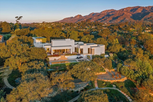 birds eye view of property with a mountain view