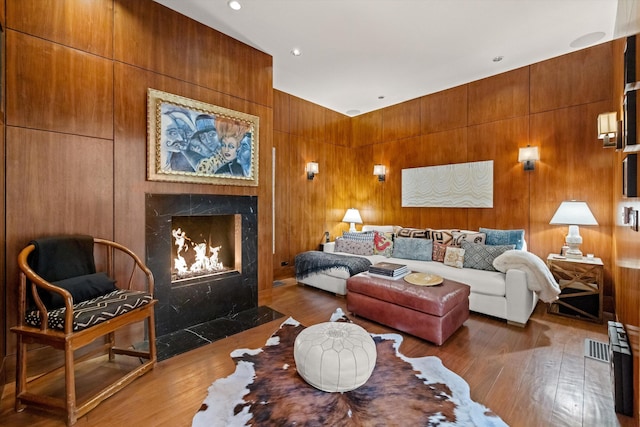 living room featuring dark hardwood / wood-style floors and a fireplace