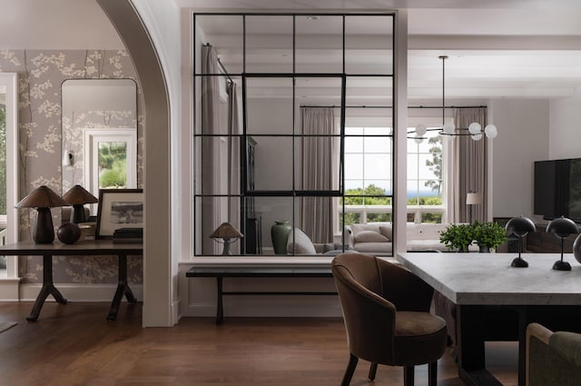 dining room with hardwood / wood-style flooring and a chandelier