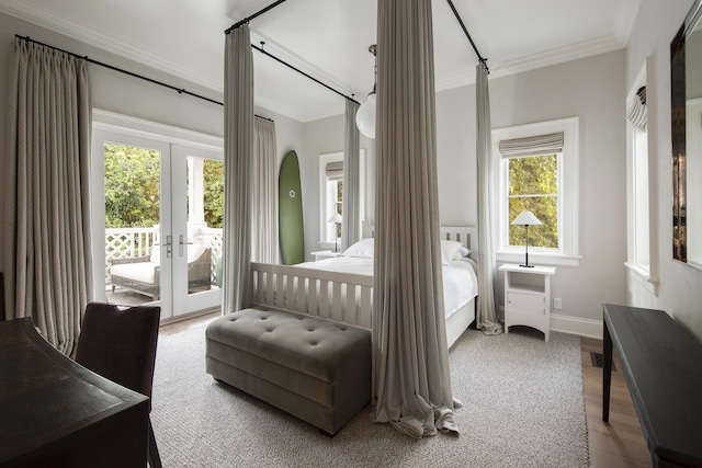 bedroom with crown molding, access to exterior, french doors, and hardwood / wood-style flooring