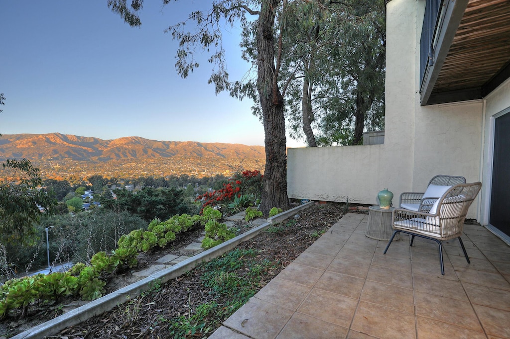 view of patio / terrace featuring a mountain view