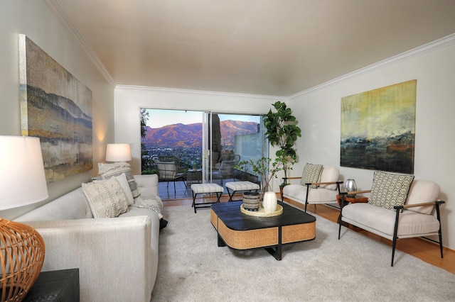 living room with light wood-type flooring and ornamental molding