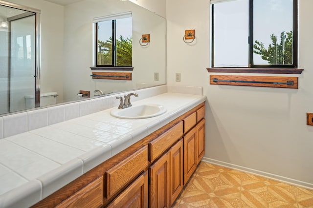 bathroom with tile patterned flooring and vanity