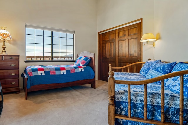 carpeted bedroom with a closet