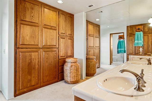 bathroom with vanity and toilet